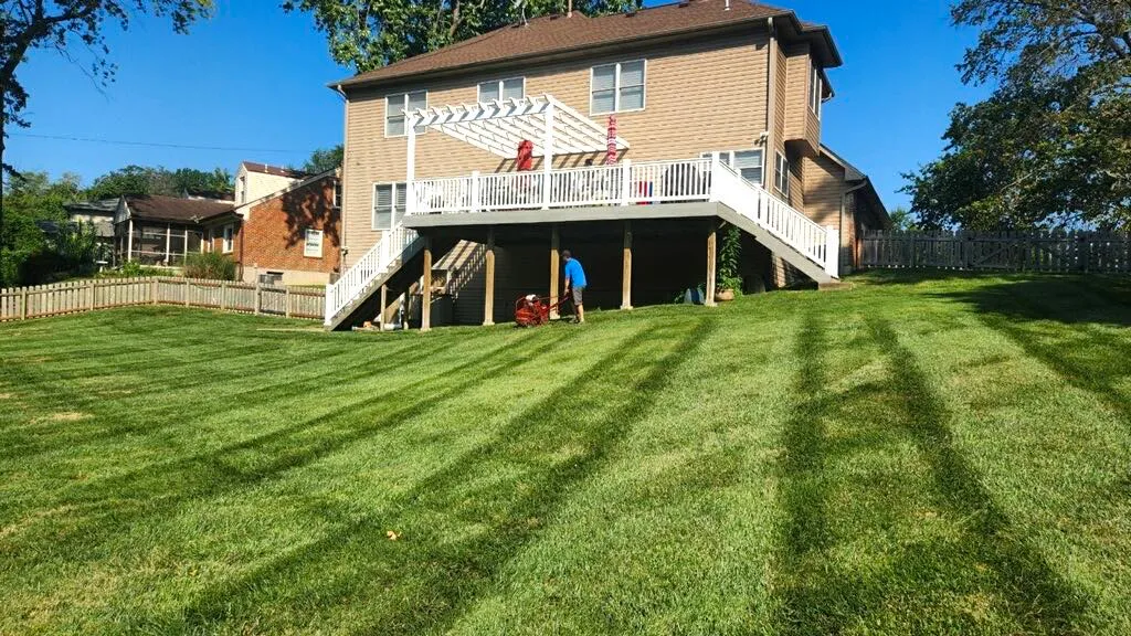 Crew and equipment during lawn maintenance